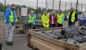 Litter pickers relaxing after working
